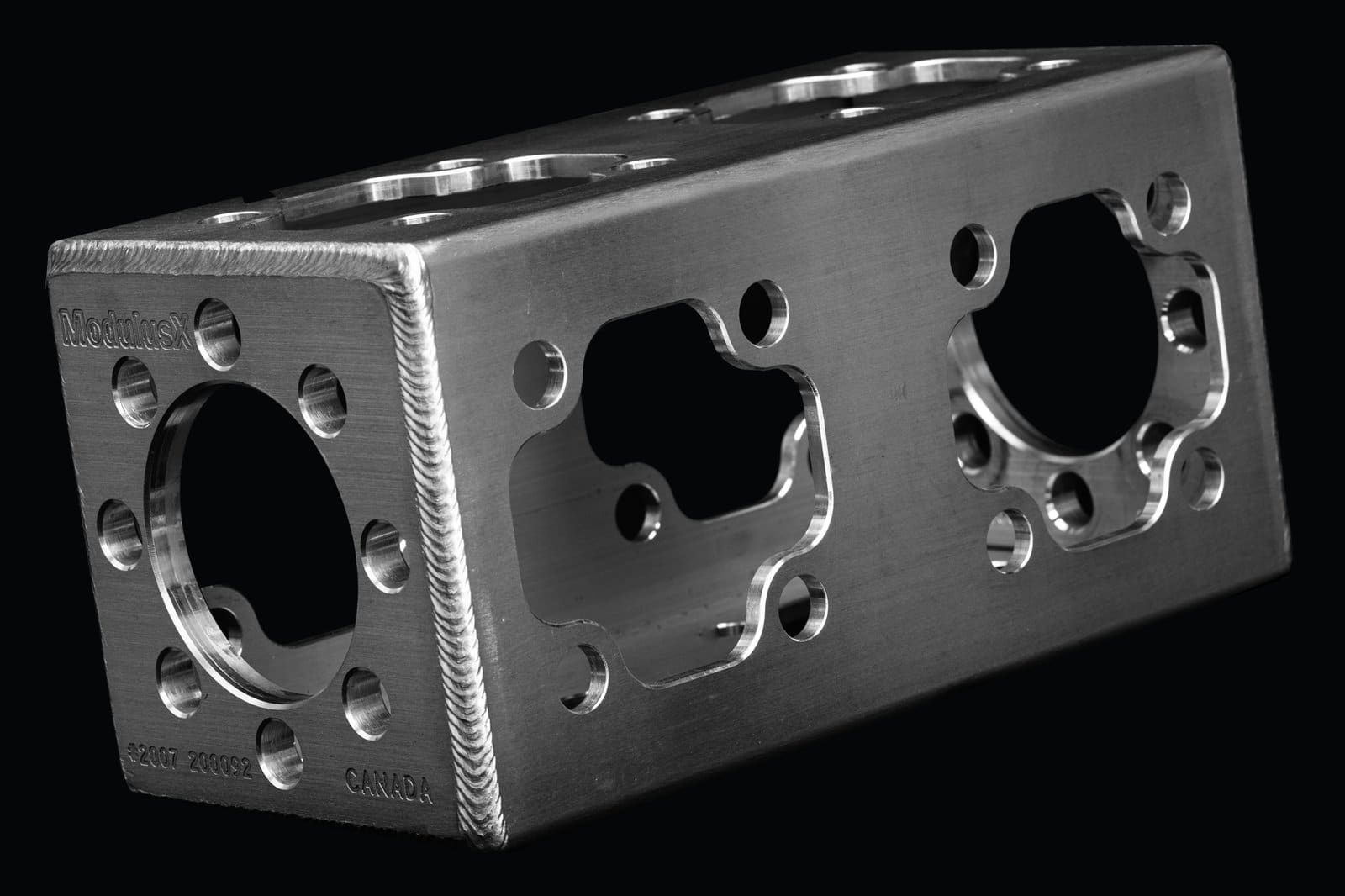 Machined Modulus-X® cube in 6061 aluminium, one bolt pattern on every face