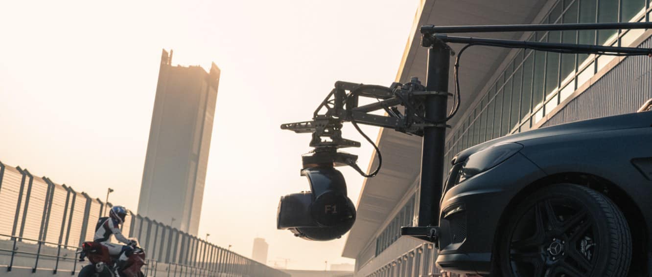 Suspension-rig camera head flying above the set